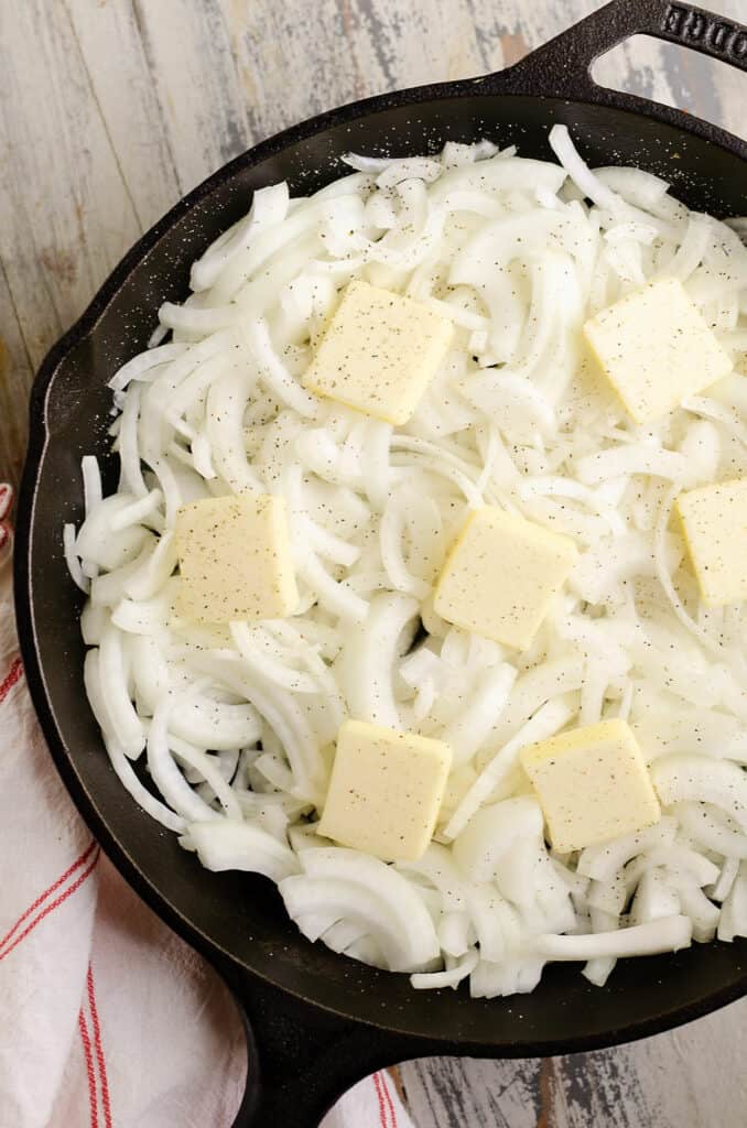 onions and butter in cast iron skillet