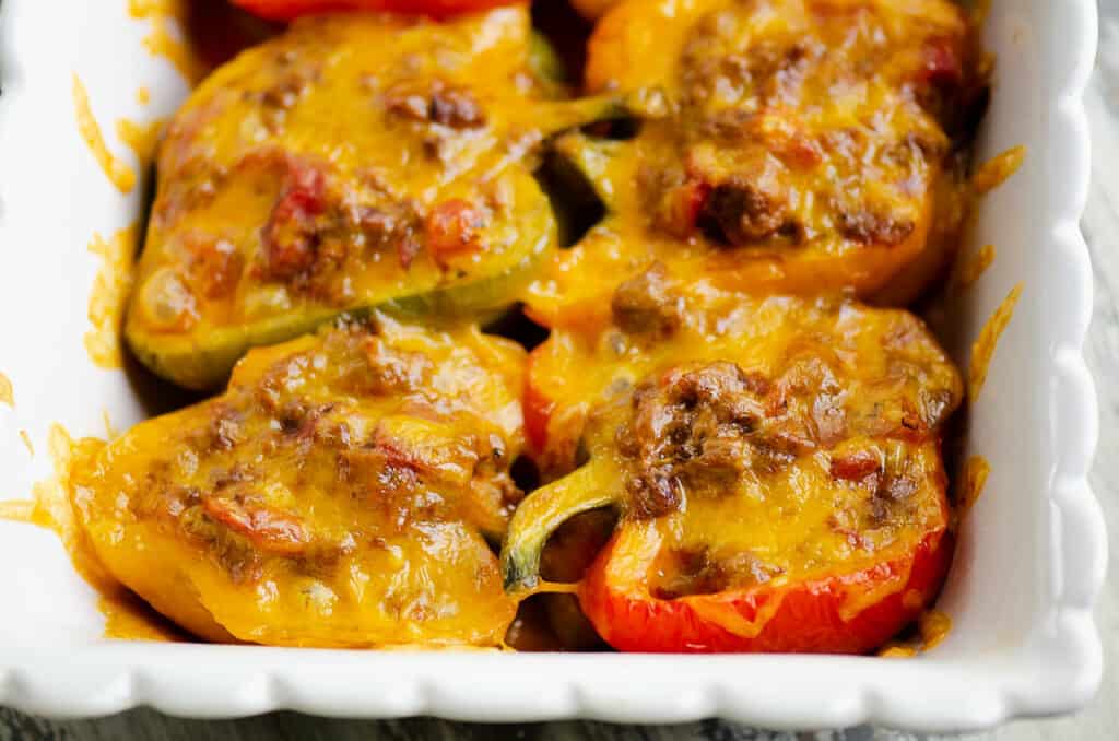 Keto Cheesy Taco Stuffed Peppers in white baking dish