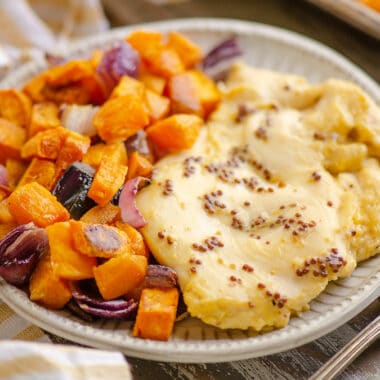 honey mustard chicken breast and roasted sweet potatoes on plate