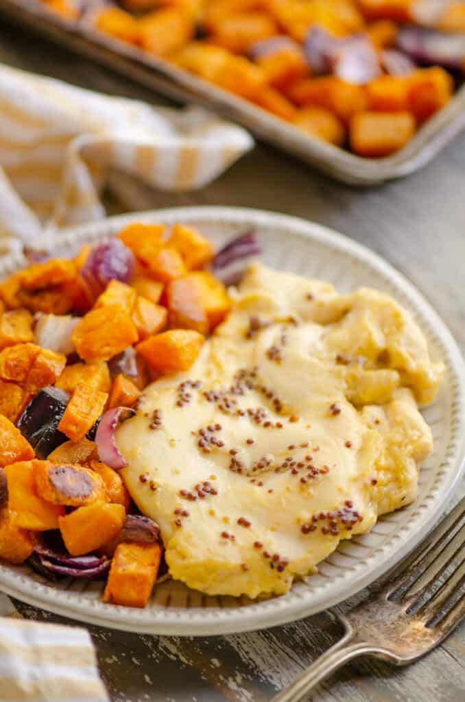 honey mustard chicken and roasted sweet potatoes on plate