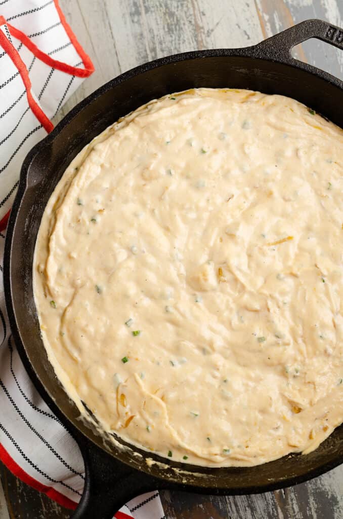 cheesy caramelized onion dip in skillet