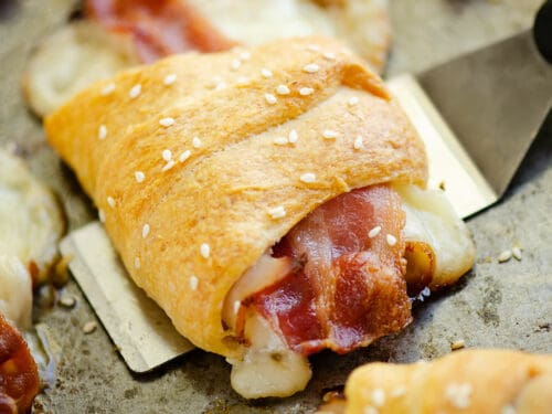 turkey, bacon and swiss cheese wrapped in crescent roll scooped with spatula