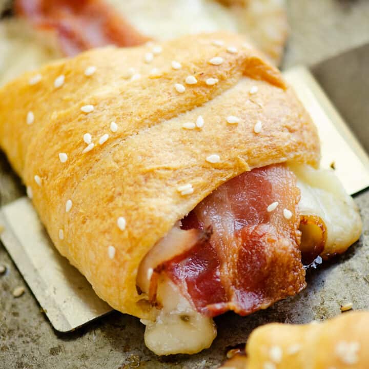 turkey, bacon and swiss cheese wrapped in crescent roll scooped with spatula
