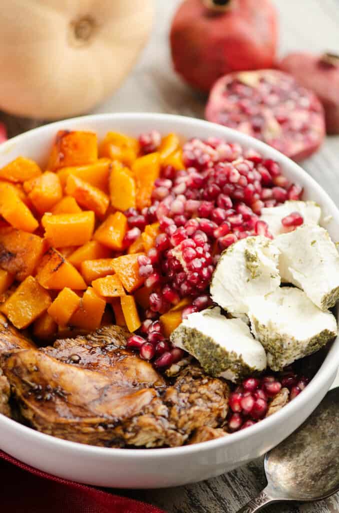 balsamic chicken & butternut squash bowl with pomegranates and herb goat cheese