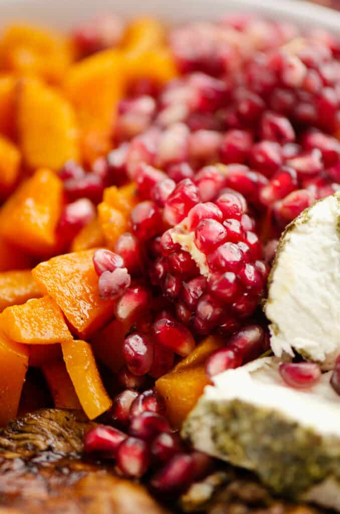 pomegranate seeds, squash and goat cheese