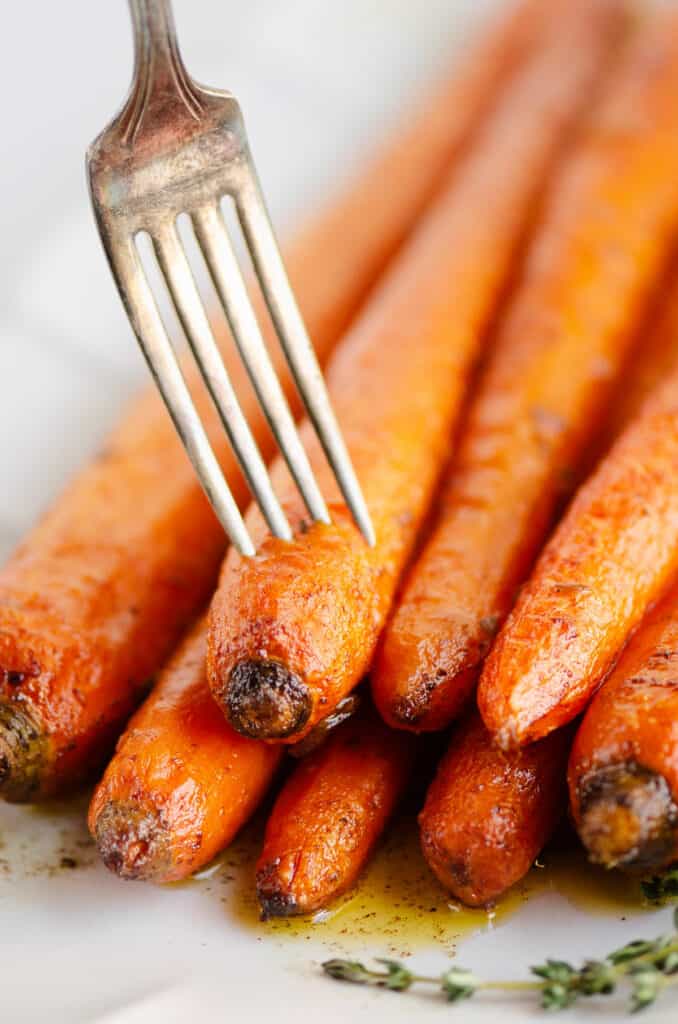 fork in tender roasted butter carrots