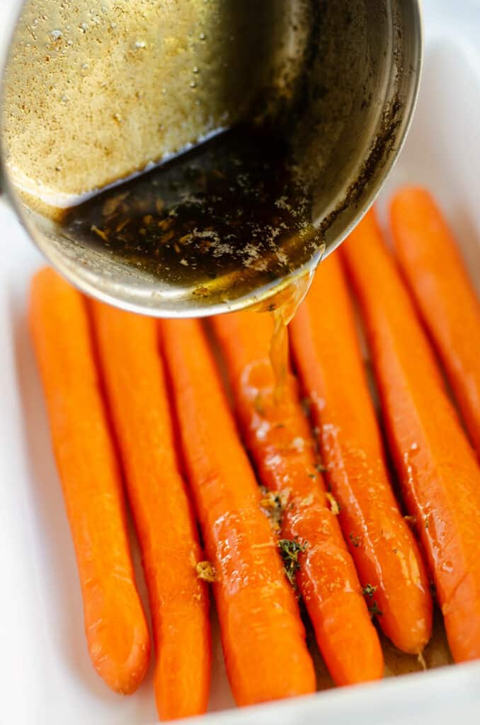 brown butter poured over carrots
