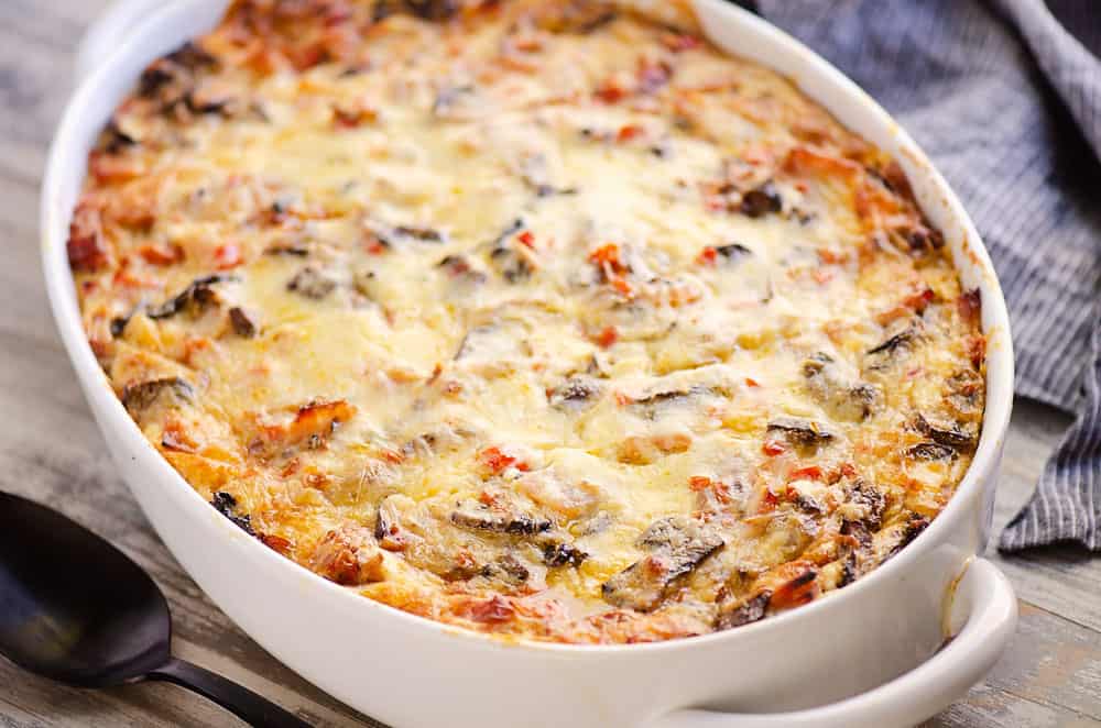 overnight ham and vegetable egg bake on table with cloth napkin