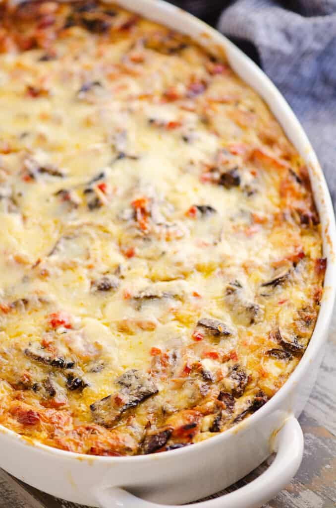 overnight ham and vegetable egg bake in white casserole