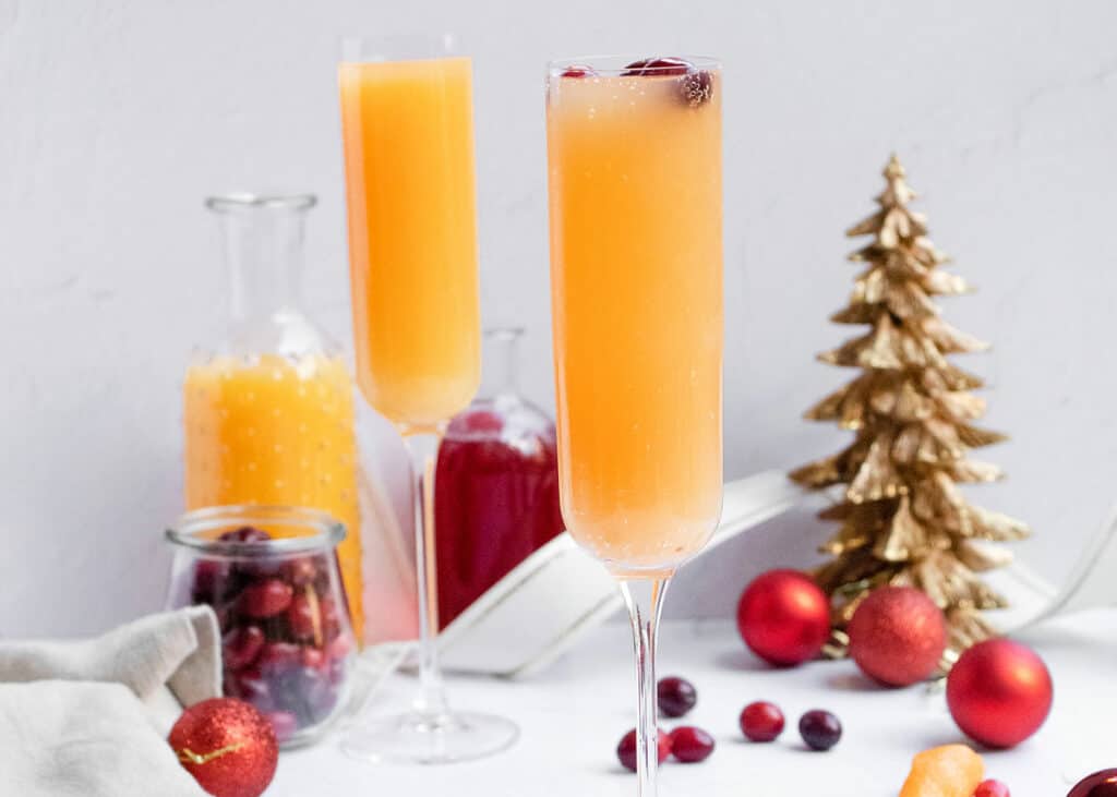 cranberry orange mimosa on holiday scape table