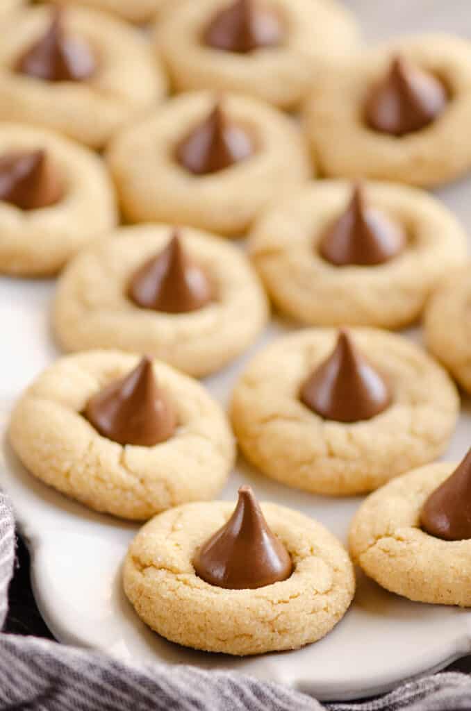 peanut butter blossom cookies on white serving platter