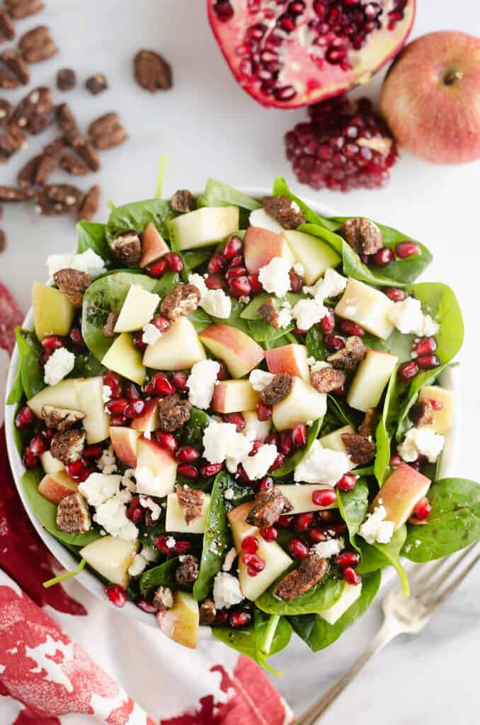 fresh spinach salad with pomegranates and apples