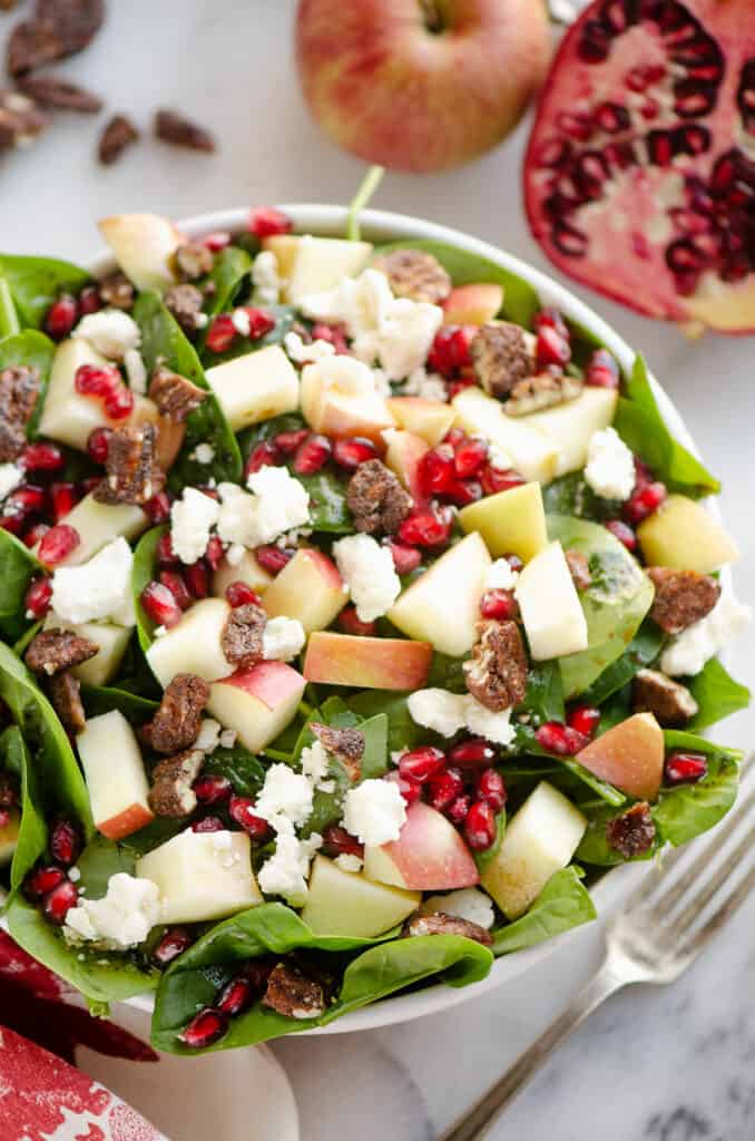 fresh spinach salad with fruit, pecans and feta