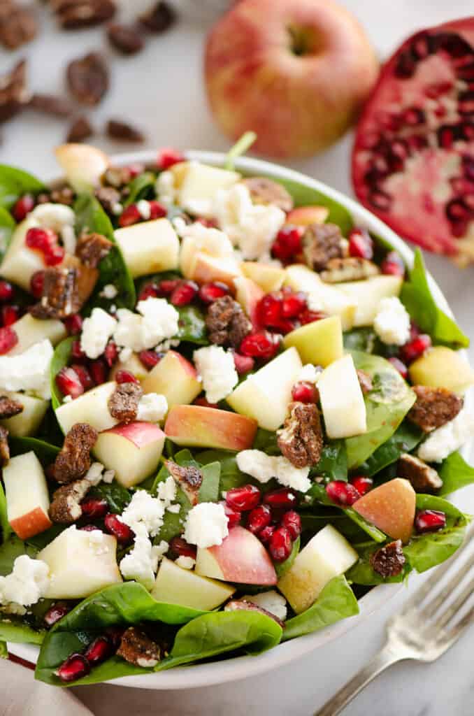 fresh spinach salad with pomegranates and apples