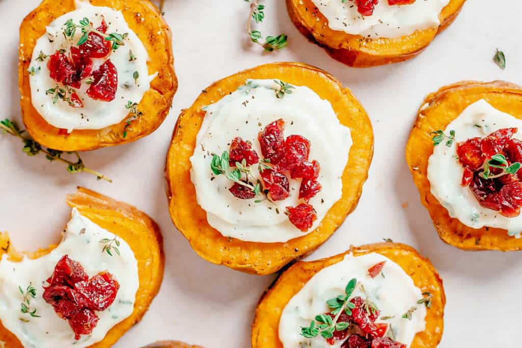 sweet potato bites topped with whipped goat cheese and cranberries