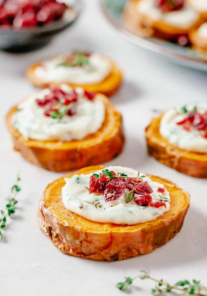 sweet potato bites on table with thyme sprigs