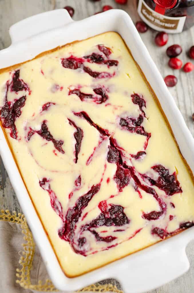 cranberry orange cheesecake swirl bars in 9x13 pan