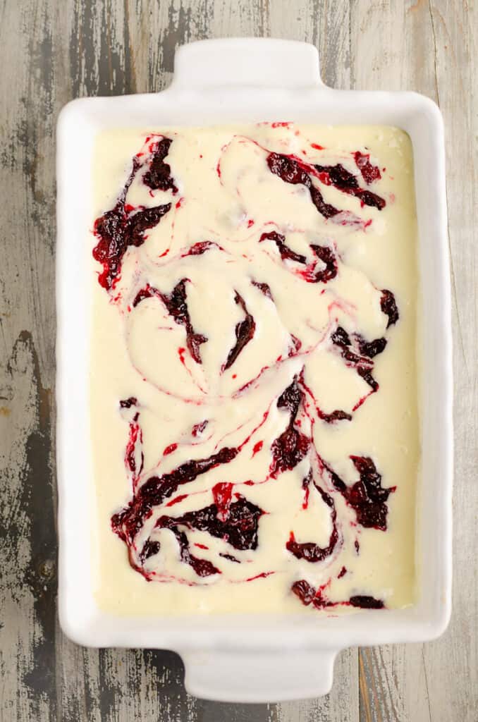 cheesecake bars swirled with cranberry orange sauce