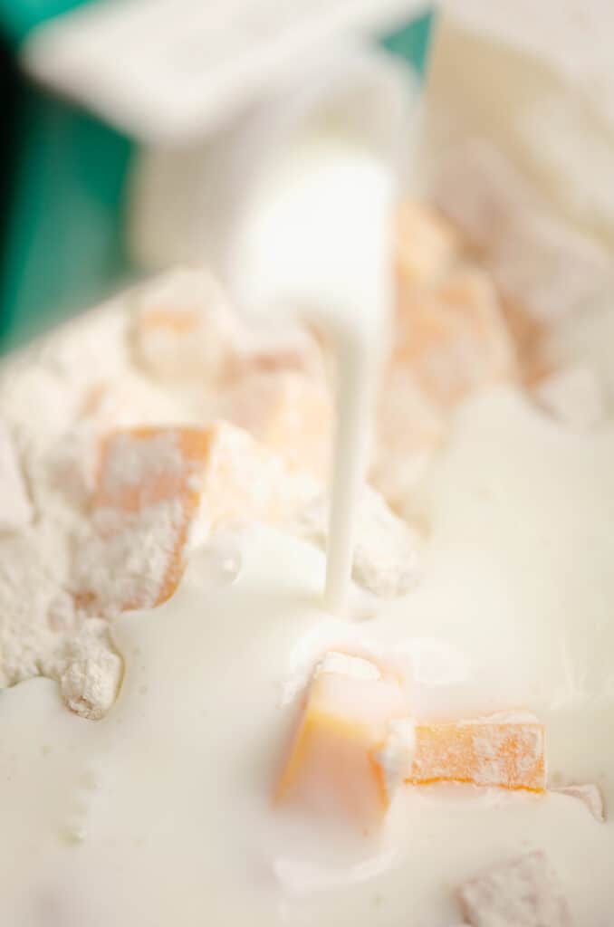 cream added to ham and cheese butter swim biscuit dough