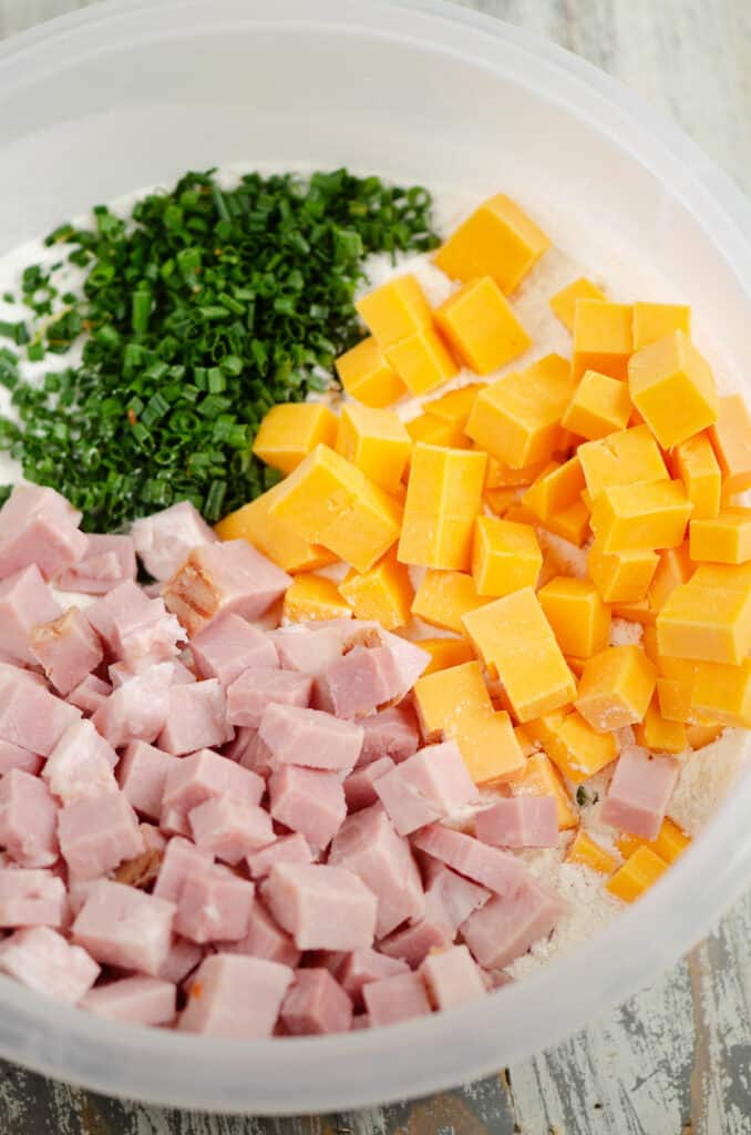 ingredients for ham and cheese butter swim biscuits in bowl