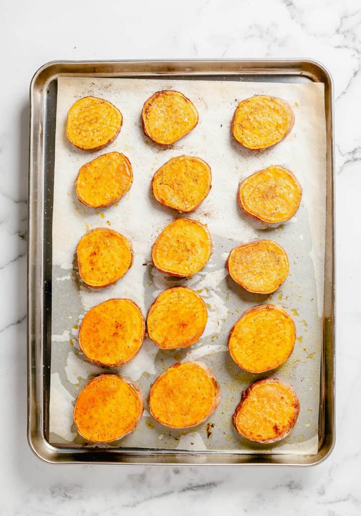 roasted sweet potato coins on baking sheet