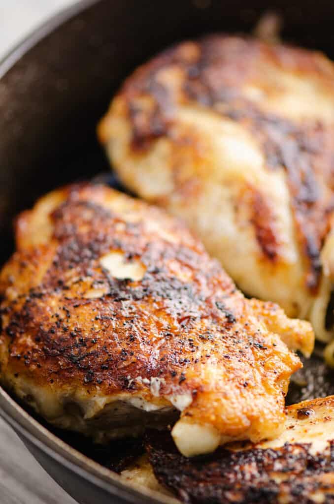 seared chicken breasts in cast iron pan