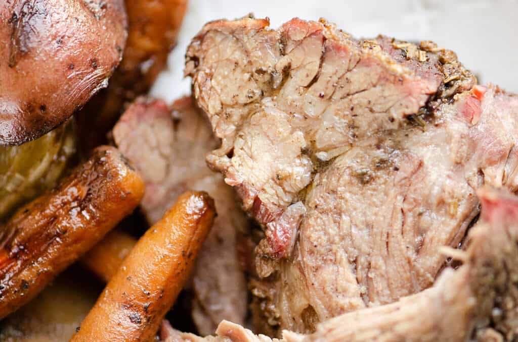 tender pot roast with vegetables on plate