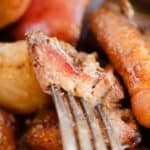 piece of pot roast with smoke ring on fork