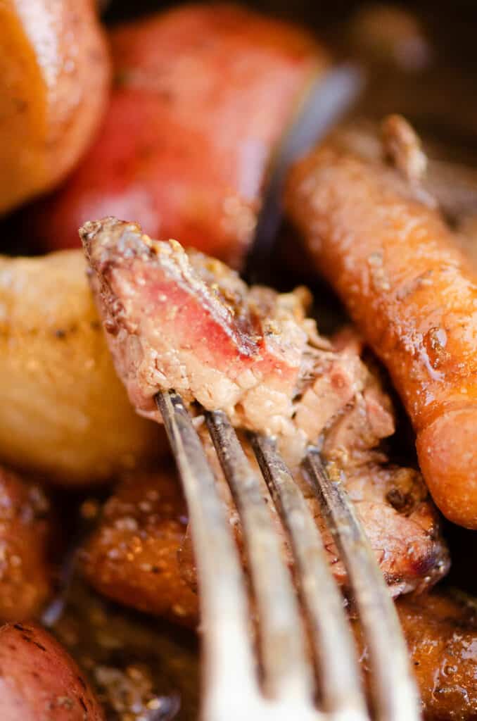 piece of pot roast with smoke ring on fork