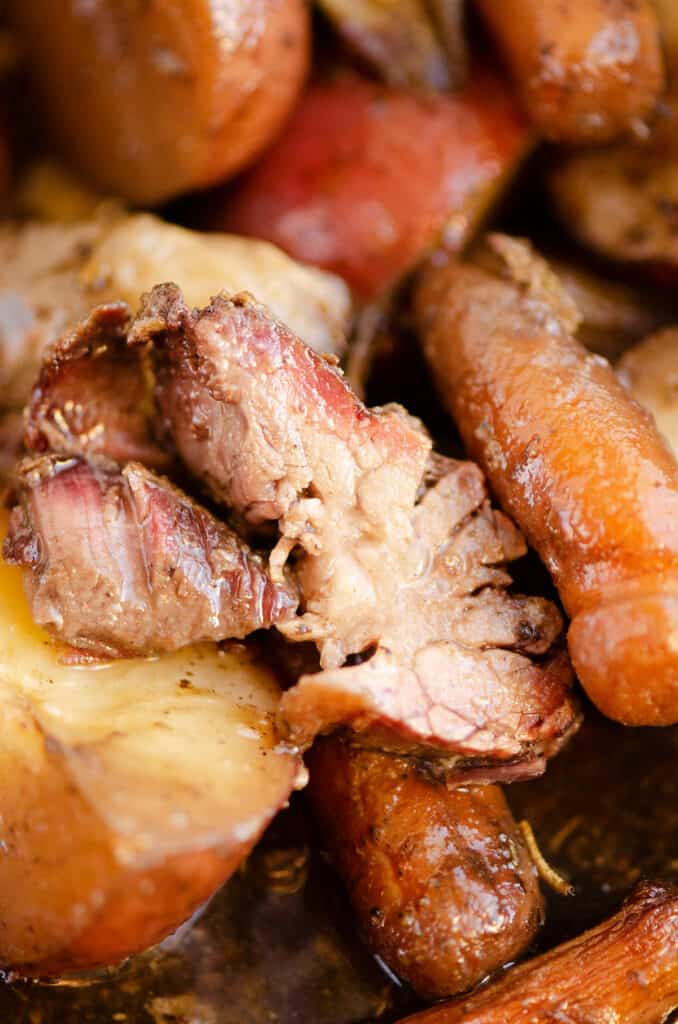 piece of pot roast with smoke ring with vegetables