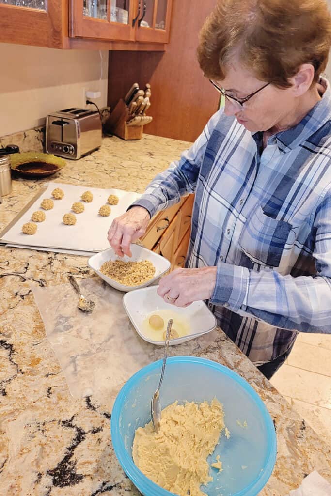 assembling thumbprint cookies in kitchen