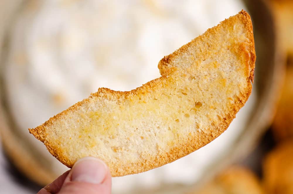 bagel chip held in hand