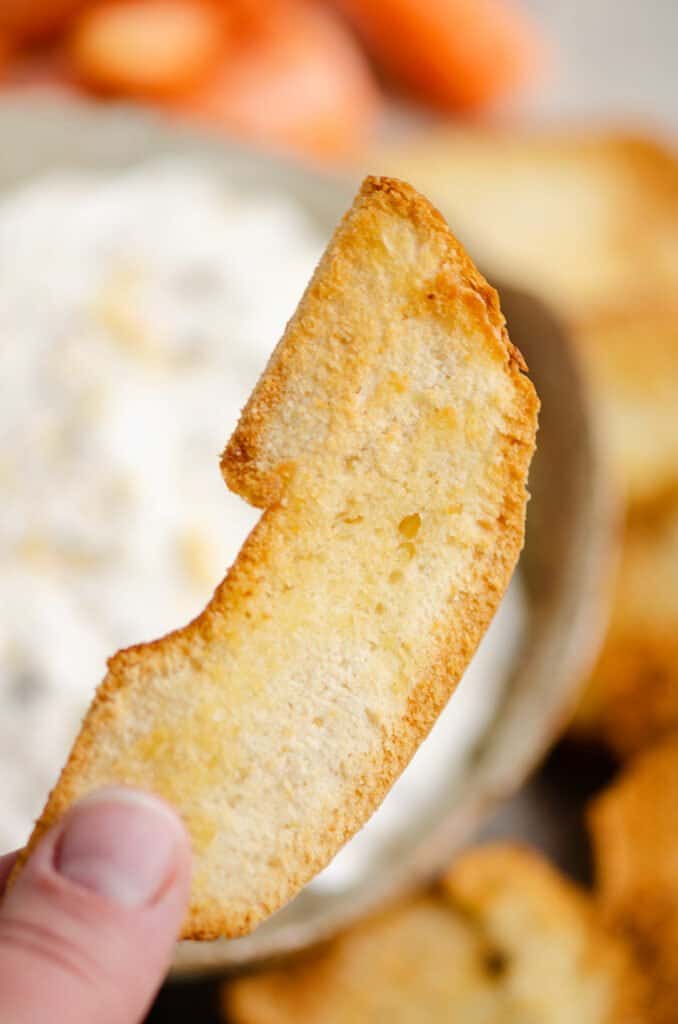 bagel chip held in hand
