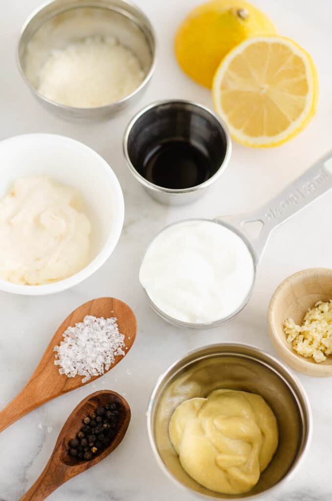 greek yogurt caesar ingredients on marble table