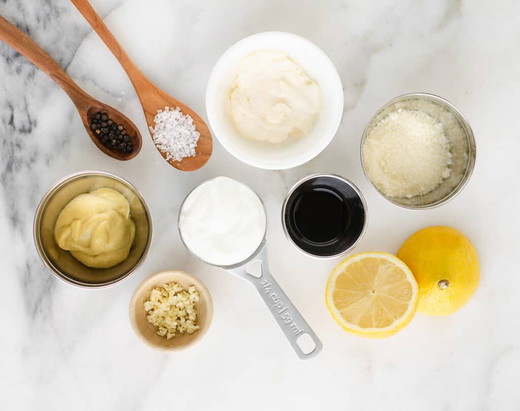 greek yogurt caesar ingredients on marble table