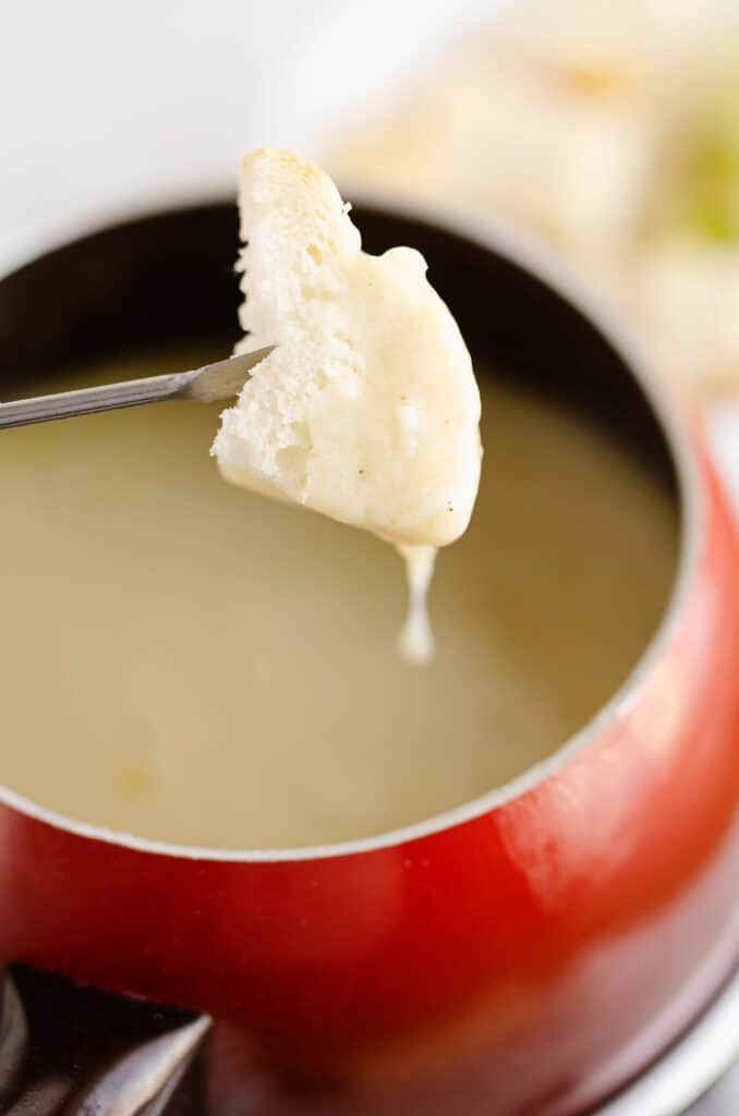 French bread dipped in cheese fondue
