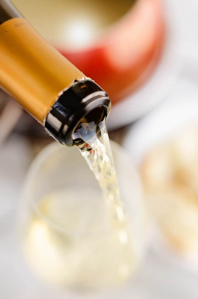 white wine poured in glass