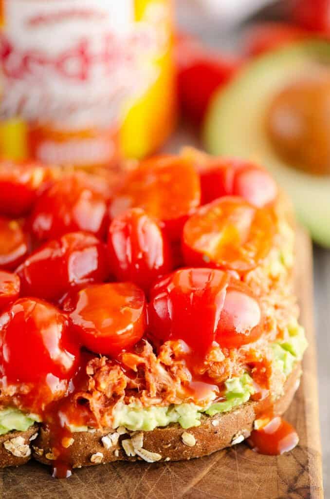 Tuna Avocado Toast drizzled with buffalo sauce