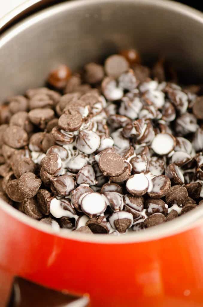 chocolate chips and cream in fondue pot