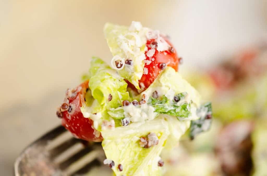 quinoa caesar chopped salad on fork