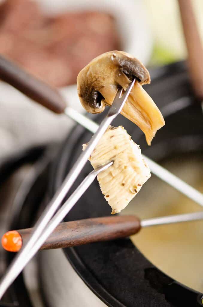 vegetable and meat cooked on fondue forks