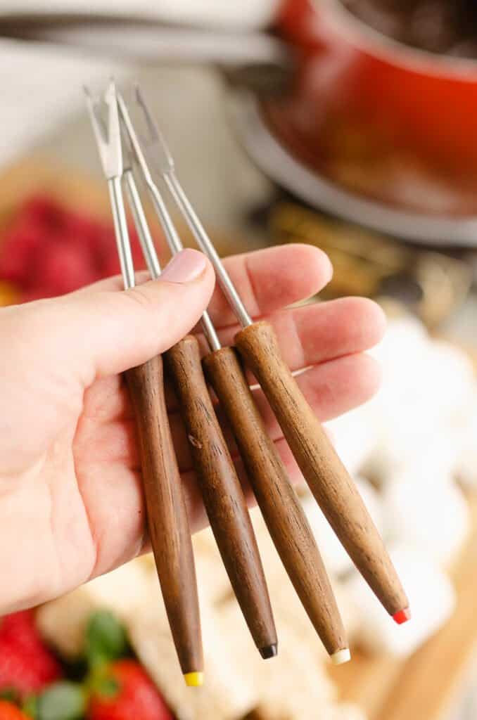 dessert fondue forks in hand