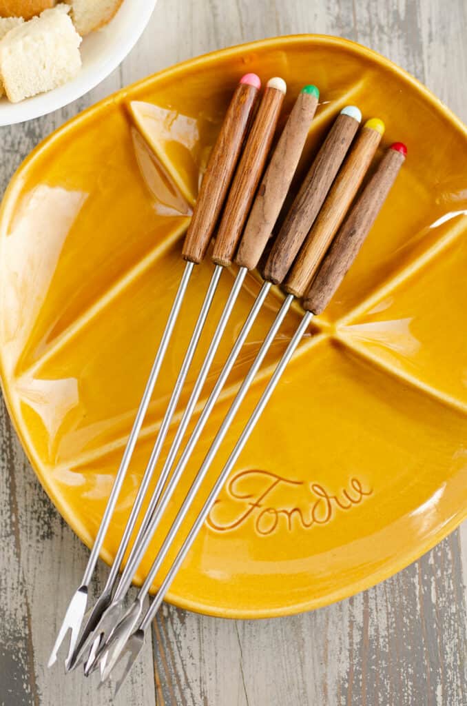 fondue forks on vintage fondue plate
