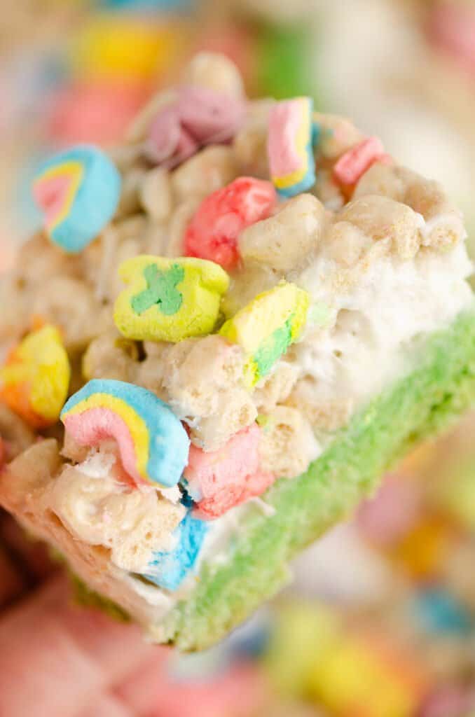 lucky charms cake and marshmallow bar in hand