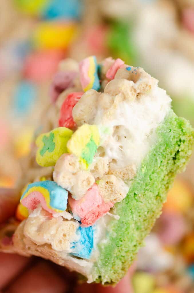 lucky charms cereal and marshmallow bar held in hand
