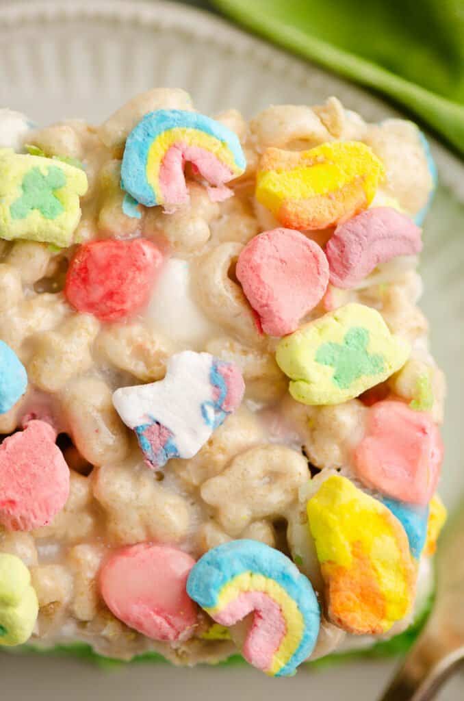 slice of lucky charms cereal bars on plate with green napkin
