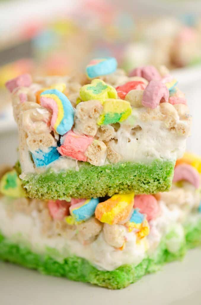 lucky charms cake bars stacked on plate