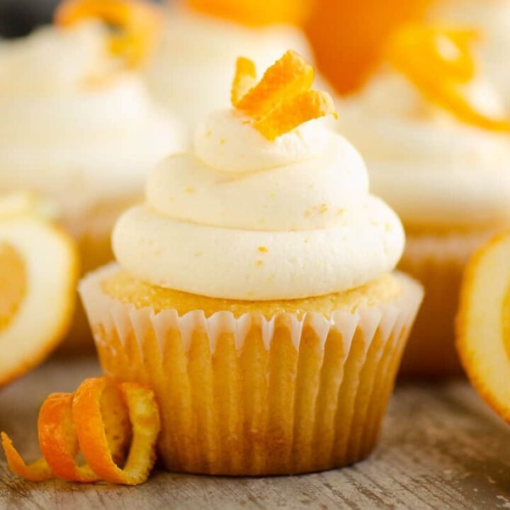 orange cupcakes with orange peel and wedges