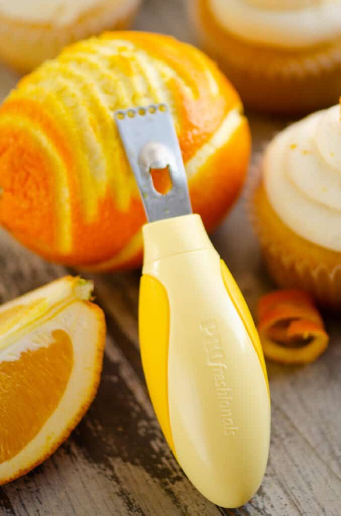 citrus zester with oranges