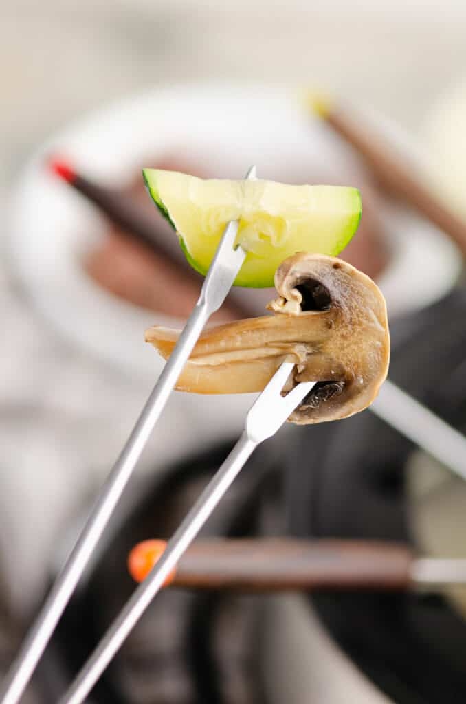 cooked vegetables on fondue forks